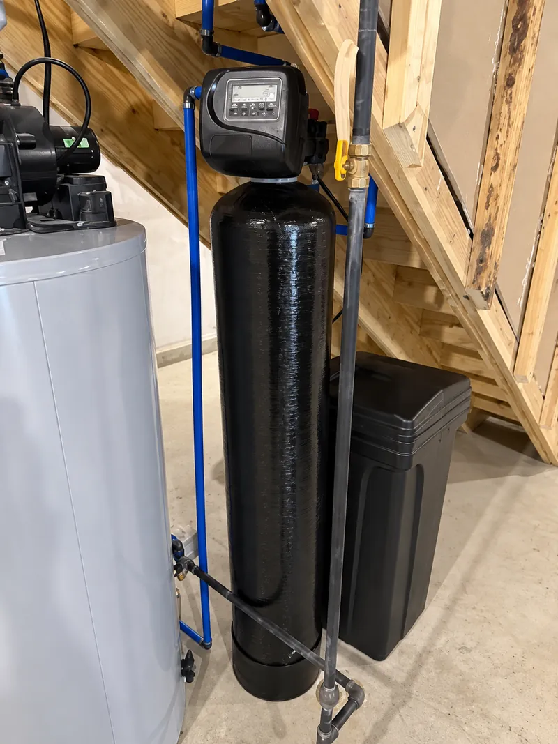Whole-home softener beside the water heater, under-stair install