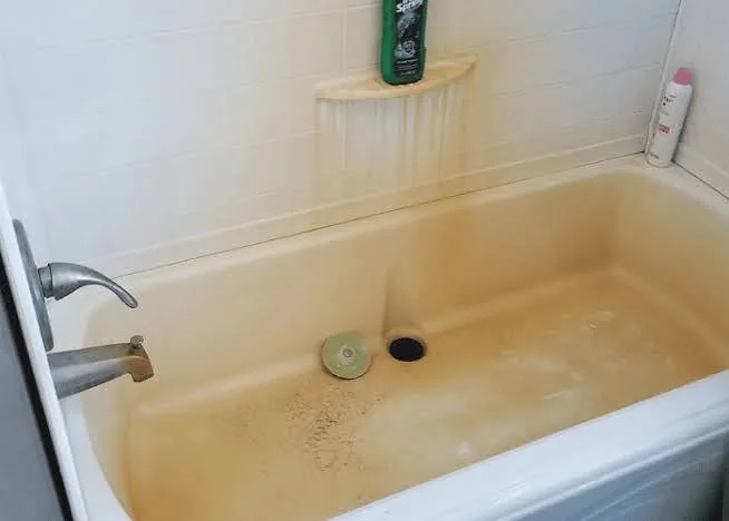 Hard water mineral stains in a bathtub